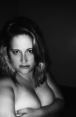 SexySarah90 wears nothing but a handbra for this black and white selfie