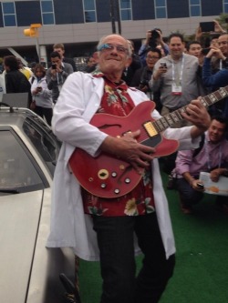 the-absolute-best-posts:  memeguy-com:  Christopher Lloyd next to a DeLorean wearing Google Glass and playing Marty McFlys Gibson from CES yesterday   
