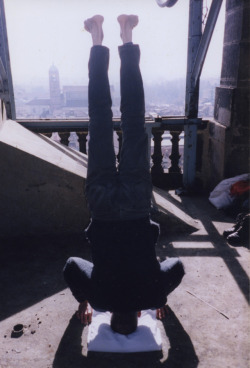 arterialtrees:Geoffrey Hendricks, Headstand, Bell Tower Torre Civica, Bergamo, Italy, 2012, Color photograph, 6 x 4 in (15.2 x 10.2 cm)
