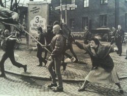2cutetopuke:  A woman hitting a neo-nazi with her handbag, Sweden, 1985. The woman was reportedly a concentration camp survivor. 