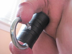 My 0 gauge 2″ circular barbell and my 4″ leather ball stretcher.