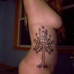 fucklikeagod:  redheadedbondage:  I got my new tattoo today! For those of you who aren’t GIGANTIC NERDS like me, this is the White Tree of Gondor from JRR Tolkien’s Lord of the Rings - with a slightly artistic twist. What an excellent Tuesday. -Kit