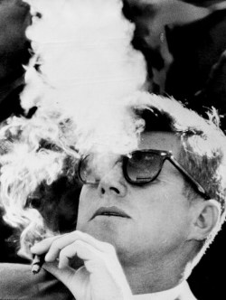 jfk-and-jackie:  JFK smoking a cigar, 1960s. 