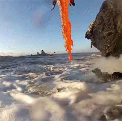 theycallmeabbey:onlylolgifs:  Lava spilling into the ocean  Tbh I scrolled past this and thought it was a dragon throwing up 