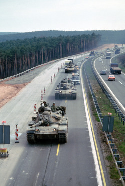 fulda-gap-express:  Autobahn 6, West Germany 1983 A view of 3rd Armored Division M-60A3 tanks and armored personnel carriers near the Sembach Air Base exit ramp. 
