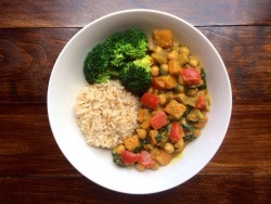 veggieomnom:  Sweet potato and chickpea coconut curry with red bell pepper, onion, garlic, spinach, and sriracha with a side of brown rice and steamed broccoli. 