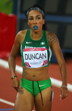 hersheywrites:olympic88:Dominique Duncan of Nigeria  Glasgow 2014 Commonwealth Games  Blue Lipstick on the track? Yaaaaaaaasssss *is given life* 