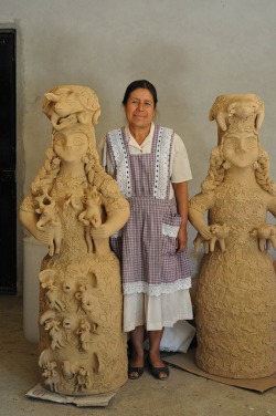 iseo58:  Master ceramic artist Irma Garcia Blanco stands between two of her amazing creations in clay. Santa Maria Atzompa, Oaxaca, Mexico 