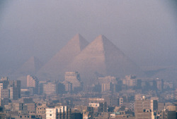 unrar:    The pyramids at Giza and Cairo in the foreground, Matrin Grey.