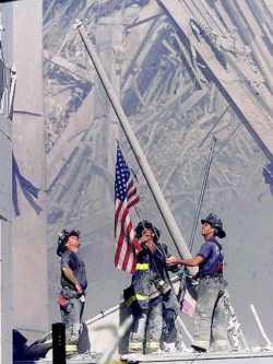 jasonm44:  Never forget September 11, 2001, World Trade Center wreckage, New York City  Hours after the 9/11 attacks, three firefighters spontaneously used a U.S. flag taken off a yacht and raised it in the wreckage of the World Trade Center. Newspaper