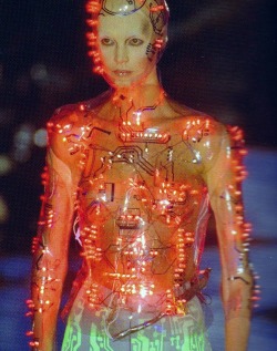 paintdeath:Cyborg. Programmed flashing LEDs mounted on transparent PetG body-hugging bodice , vac-formed from plaster body-cast. Concept by Alexander McQueen . Designed and made by Studio van der Graaf London , for Alexander McQueen at Givenchy , Paris