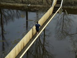bandit2k:  sixpenceee:  MOSES BRIDGE, NETHERLANDS It was originally built in the early 1700’s to protect the Netherlands from invasions. It is constructed out of Accoya wood, a waterproof wood. The designers assured that flooding will not be a problem