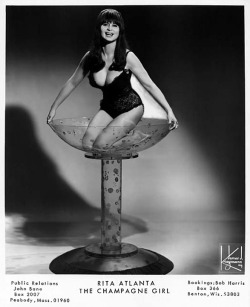  Rita Atlanta      aka. “Miss International”.. Late-period promo photo, featuring her signature Champagne Bath glass.. 