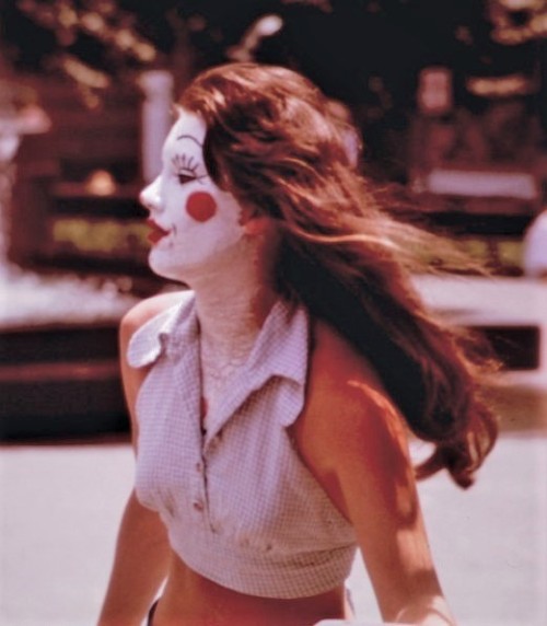 aloneandforsakenbyfateandbyman:    Girl Made Up for a Sorority Initiation Crosses Fountain Square. Photographed by Tom Hubbard, June 1973.