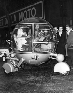 A car of totally new design, the automodul, driven by its designer J.P. Ponthieu, at the opening of the first Racing Car and Cycle show in Paris, 1970.