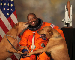 NASA astronaut Leland D Melvin with his dogs Jake and Scout. 