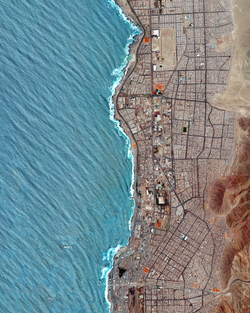 dailyoverview:  Waves of the Pacific Ocean roll into Antofagasta, Chile. Since the city is situated in the Atacama Desert — the driest region in the world — it has incredibly sparse vegetation. In total, Antofagasta is home to nearly 400,000 residents
