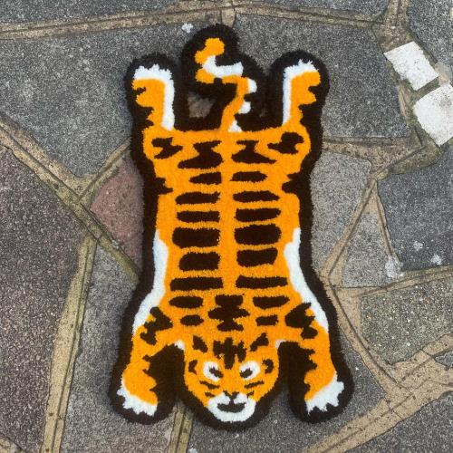 blondebrainpower:Striped Orange FelineReddit user olilon, Yarn, 2022 27” x 15”Human Made / LV Made Nigo Style Tiger Rug