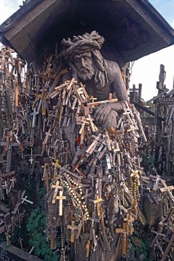 Statue of Christ and crosses left by pilgrims, Hill of Crosses