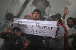 Thepoliticalnotebook:  Protesters In New Delhi Are Hit With A Police Water Cannon