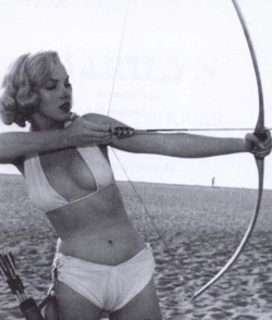 talesfromweirdland:Marilyn Monroe tries archery. Photo by Anthony Beauchamp, 1951.