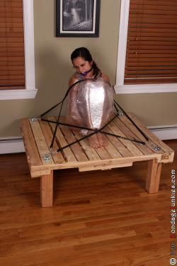 Abby is wrapped tight and #mummified while strapped to a shipping pallet #bondage http://bit.ly/1XbygVn