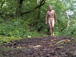 Nude walk alongside a river bank
