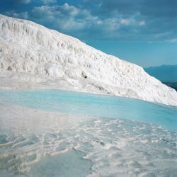 lensblr-network:  Turkeyâ€™s otherworldly Pamukkale, made up of terraced calcium carbonate deposits and hot springs photo by Pei KetronÂ  (penelopesloom.com)   I traveled to Pamukkale 6 yrs ago, and it is seriously stunning. Also fun to scoop up the clay