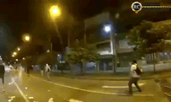 bluntforceheadtrauma:  onlylolgifs:  Hong Kong protester catching a tear gas grenade and throwing it back  RUTHLESS 