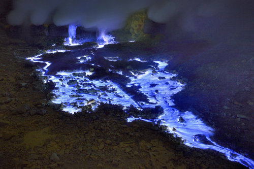 coolthingoftheday:  Indonesia’s Kawah Ijen is a volcano near East Java that erupts blue lava from its crater. The volcano spews sulphuric gases into the air, which is set ablaze by the heat of the magma, making it appear blue.  I’ve been here
