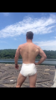 dledmike:  I dont know what turns me on more…the spread of his muscular back or that diaper!!! :0