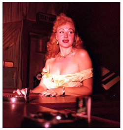     Lynne O’Neill     aka. &ldquo;The Original Garter Girl&rdquo;.. Photographed at the bar of ‘Georgia’s Blue Room’ in New York City, where she often performed during the mid-1950&rsquo;s..    