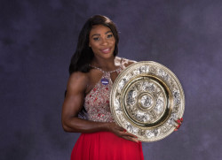 thepowerofblackwomen:    Serena Williams poses with the trophy at the Wimbledon Champions Dinner in London July 2016. 