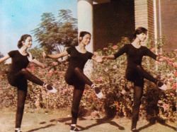pill:     Girls from the Iraqi National school of Music and Ballet practicing outside, Baghdad 1975.  