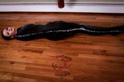 Mummified for the first time, Raven quickly discovered black vinyl tape plays for keeps #bondage #mummification #vinyl #strict http://j.mp/2yt9utH