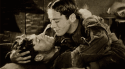 yahtzee63:  spockyourmind:  The first on-screen kiss between two men. “Wings”, 1927  This doesn’t show exactly what the caption suggests it shows.   In this scene, the lower pilot is dying. He had been captured, managed to escape, and stole a German