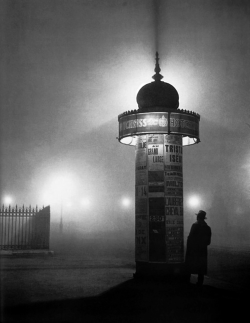 onlyoldphotography:  Brassaï: Morris Column in the Fog, 1932  Brassaï made his name as a chronicler of the night. His book Paris de nuit (1932) surveys the activities and topography of the city after dark, from the louche bars of Montparnasse to the
