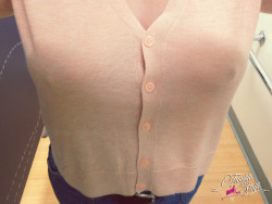 Mrs in the store trying on tops sans-bra once again! 