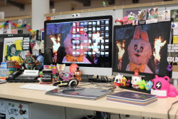 jamfactory:  I was just looking for some files on my work machine and I found these pics of my desk I think i snapped for a magazine. I’m really curious as to what other peoples work spaces look like so I thought I’d share mine. I love toys and I