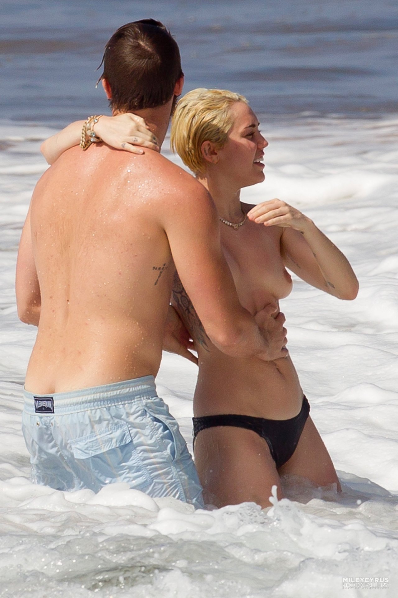 toplessbeachcelebs:  Miley Cyrus (Singer) swimming topless in Hawaii (January 2015) -