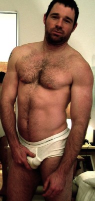 briefstimeblog:  muscledlust:  This man could not get any hotter.  Looks like he just got up and needs his morning wood taken care of.  I’ll throw him back in bed, mount that ass and fill him with me seed.  Bet he’ll come back for more!  Fruit