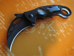 gunsknivesgear:  Emerson Karambit. The karambit is a fascinating blade style.  In Southeast Asian martial arts, the knife not only cuts and stabs, it can hook, restrain, control, takedown and lock.  The knife becomes a brutal extension of the grappling