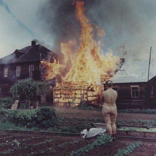 unsubconscious:  A member of the Freedomite Doukhobor religious sect watches a farm that was set on fire as part of a protest in Kootenay, Canada, June 1963