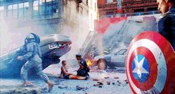  LET ME POINT OUT OF THE IMPORTANCE OF THIS SCENE: Here, Captain America - a hero in this film - is standing still while three other kinds of heroes, rush around to do thier job. (this is in no way bashing Cap, he is simply standing still at this moment,