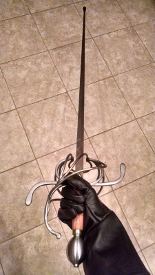 wearefighter: A few pictures of my rapier, spurred by chatting about fencing with @wearebard. Darkwood Armories, three-ring swept hilt rapier with cherry handle and a 39″ practice blade (with a blunt, hence the wonky-looking tip). 46″ total length,