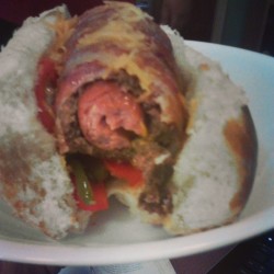 misfitpr1ncess:  Daddy made Triple Plays tonight!  Turkey hotdogs surrounded by beef wrapped in bacon on a bed of peppers and onions.  { #food #foodporn #TriplePlay #omg #bacon }