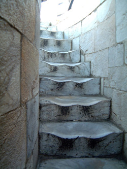 sixpenceee:The worn marble steps at the Leaning Tower of Pisa. This is the result of 500 years of walking.  
