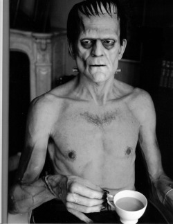 Boris Karloff relaxes on set with a cup of tea during the filming of “Frankenstein”, 1930