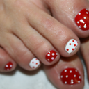 fantasyfootjobs:  A footjob/handjob combo with black nails and polka dot toes!