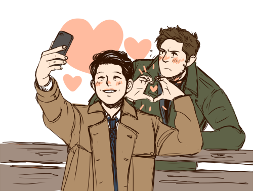 diminuel:Dean and Cas taking a selfie.This was a ko-fi prompt for CodenameFinlandia! ♥ Dean’s somewhat embarrassed about it, but he’ll still want a copy of the picture. ;3(My ko-fi)